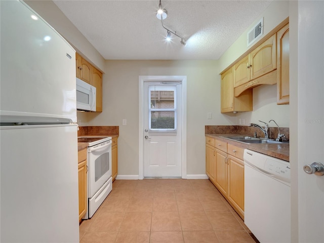 200 Saint Andrews Blvd Unit 2306, Winter Park, FL 32792 - kitchen with white appliances, light brown cabinetry, light tile patterned floors, a textured ceiling, and track lighting