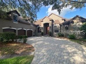 708 Palenci Ct, Winter Springs, FL 32708 - view of front of home featuring decorative driveway