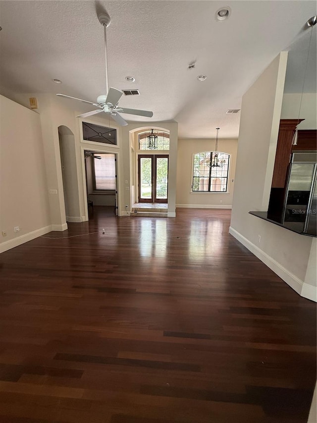 708 Palenci Ct, Winter Springs, FL 32708 - unfurnished living room featuring dark wood-type flooring, arched walkways, a ceiling fan, baseboards, and recessed lighting