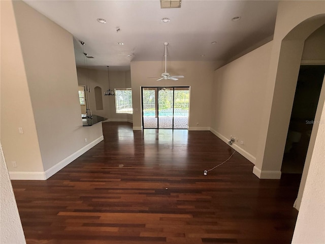 708 Palenci Ct, Winter Springs, FL 32708 - unfurnished living room featuring arched walkways, a ceiling fan, wood finished floors, recessed lighting, and baseboards