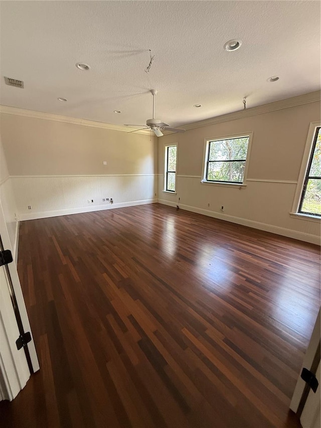 708 Palenci Ct, Winter Springs, FL 32708 - unfurnished room featuring dark wood-type flooring, healthy amount of natural light, crown molding, ceiling fan, and a textured ceiling