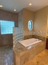 708 Palenci Ct, Winter Springs, FL 32708 - full bath featuring a garden tub, vanity, tile patterned flooring, and recessed lighting