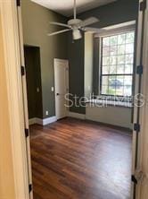 708 Palenci Ct, Winter Springs, FL 32708 - unfurnished bedroom with dark wood finished floors, baseboards, and ceiling fan