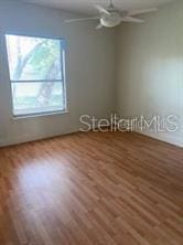 708 Palenci Ct, Winter Springs, FL 32708 - empty room with wood finished floors and a ceiling fan