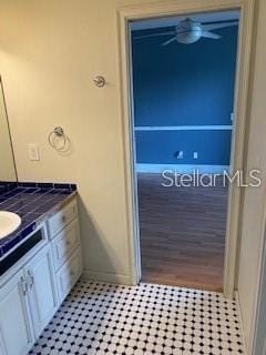 708 Palenci Ct, Winter Springs, FL 32708 - bathroom with vanity, baseboards, and a ceiling fan