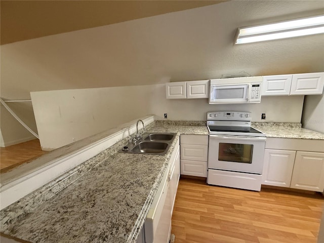 708 Palenci Ct, Winter Springs, FL 32708 - kitchen with white appliances, a sink, light wood-type flooring, white cabinets, and light stone counters