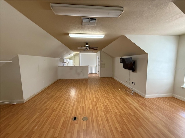 708 Palenci Ct, Winter Springs, FL 32708 - additional living space with light wood finished floors, baseboards, ceiling fan, a textured ceiling, and lofted ceiling