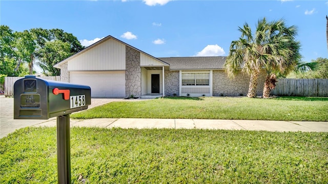 1458 Heather Way, Kissimmee, FL 34744 - ranch-style home featuring fence, an attached garage, a front lawn, stone siding, and driveway