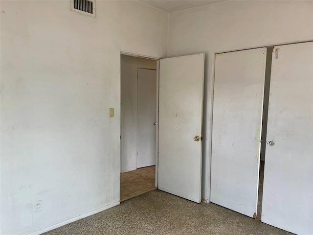unfurnished bedroom with visible vents