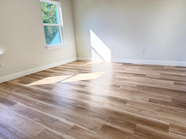 2406 SW 163rd Pl, Ocala, FL 34473 - empty room with light wood-style floors and baseboards