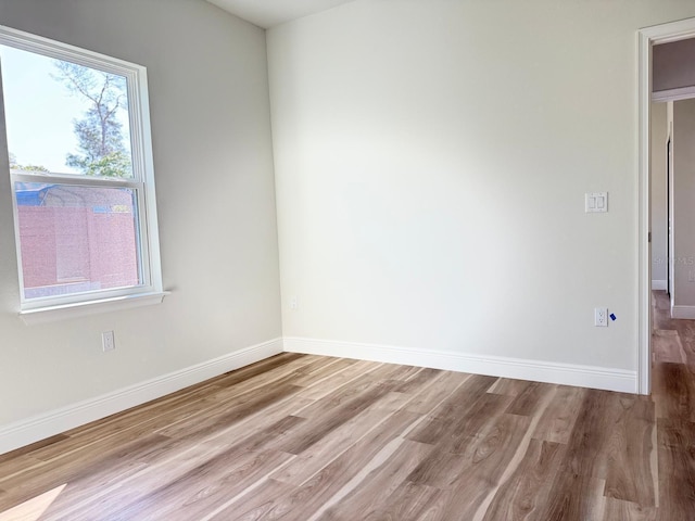 2406 SW 163rd Pl, Ocala, FL 34473 - spare room featuring wood finished floors and baseboards