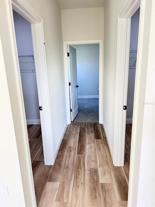 2406 SW 163rd Pl, Ocala, FL 34473 - hall with wood finished floors and baseboards