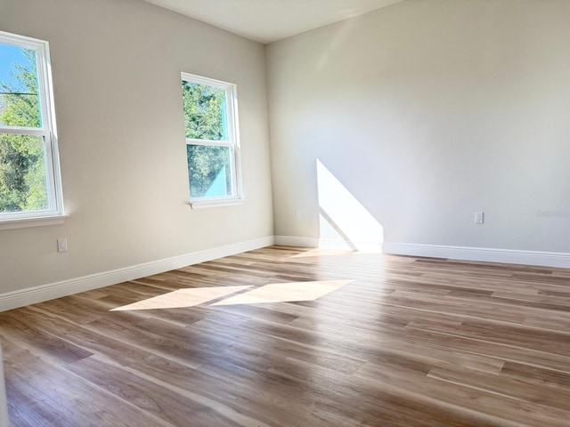 2406 SW 163rd Pl, Ocala, FL 34473 - unfurnished room featuring healthy amount of natural light and wood finished floors