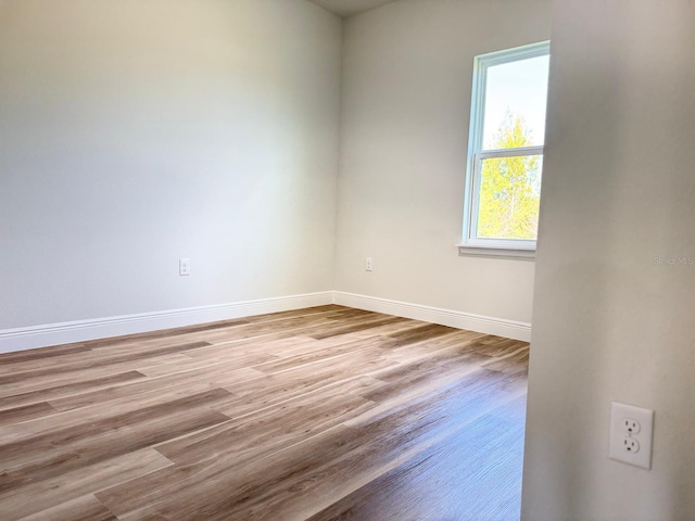 2406 SW 163rd Pl, Ocala, FL 34473 - unfurnished room featuring baseboards and wood finished floors