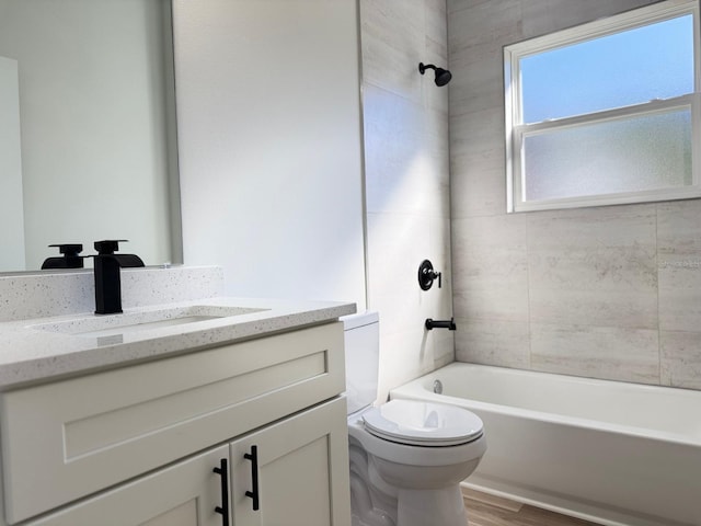 2406 SW 163rd Pl, Ocala, FL 34473 - full bath with toilet, bathtub / shower combination, wood finished floors, and vanity