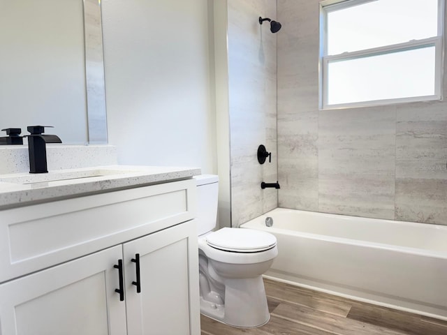 2406 SW 163rd Pl, Ocala, FL 34473 - full bathroom with toilet, shower / washtub combination, vanity, and wood finished floors