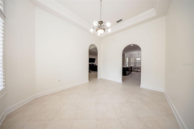 878 Cardinal Pointe Cv, Sanford, FL 32771 - unfurnished dining area with visible vents, ornamental molding, a raised ceiling, arched walkways, and a notable chandelier