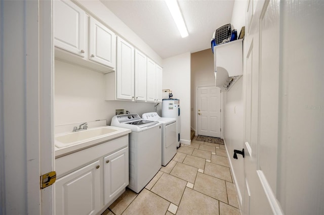 878 Cardinal Pointe Cv, Sanford, FL 32771 - clothes washing area with a sink, light tile patterned floors, cabinet space, and washing machine and clothes dryer