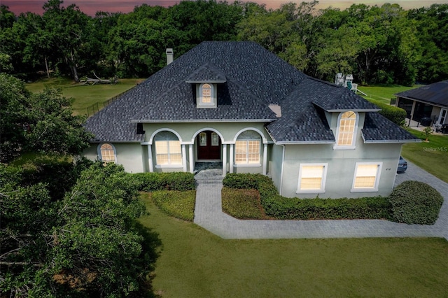 878 Cardinal Pointe Cv, Sanford, FL 32771 - view of front of property with a front yard and stucco siding
