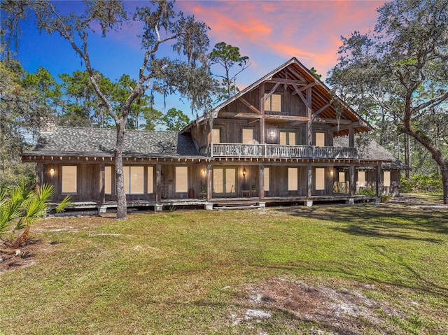 3939 Lake Erie Rd, Groveland, FL 34736 - back of house with a lawn and a wooden deck