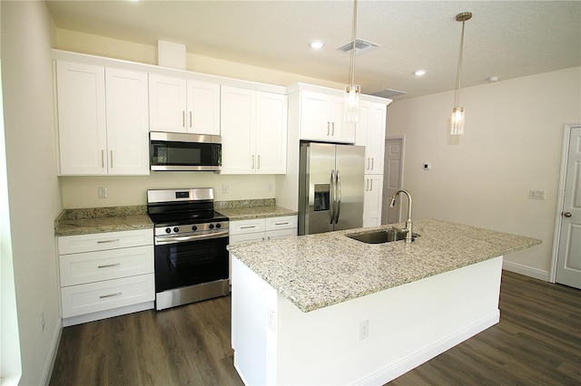 8990 Glenarm Way, Weeki Wachee, FL 34613 - kitchen with appliances with stainless steel finishes, a sink, dark wood-type flooring, white cabinetry, and recessed lighting