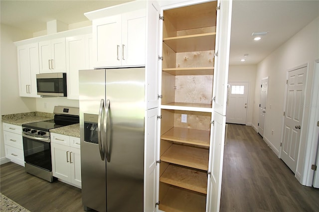8990 Glenarm Way, Weeki Wachee, FL 34613 - kitchen featuring appliances with stainless steel finishes, dark wood finished floors, white cabinetry, light stone counters, and recessed lighting