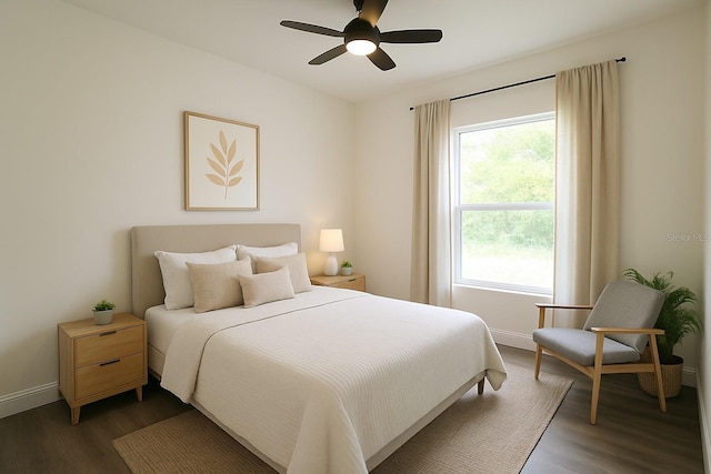 8990 Glenarm Way, Weeki Wachee, FL 34613 - bedroom featuring dark wood-style flooring, baseboards, and ceiling fan