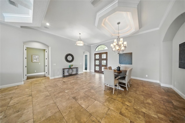 7624 Pointe Venezia Dr, Orlando, FL 32836 - dining room with arched walkways, french doors, crown molding, a chandelier, and recessed lighting