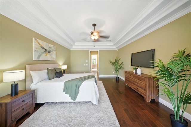 7624 Pointe Venezia Dr, Orlando, FL 32836 - bedroom featuring a raised ceiling, ornamental molding, wood finished floors, and a ceiling fan