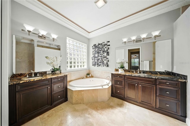 7624 Pointe Venezia Dr, Orlando, FL 32836 - full bathroom featuring crown molding, two vanities, a garden tub, and tile patterned flooring
