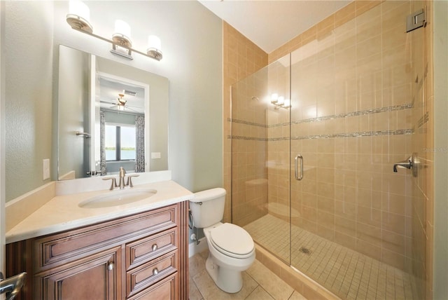 7624 Pointe Venezia Dr, Orlando, FL 32836 - bathroom with a stall shower, tile patterned floors, vanity, and ceiling fan