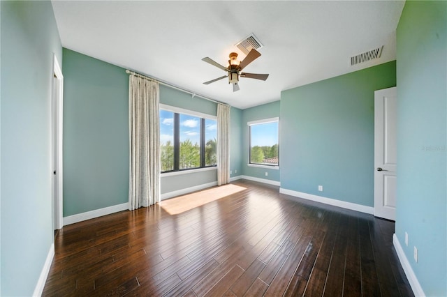 7624 Pointe Venezia Dr, Orlando, FL 32836 - spare room with a ceiling fan and dark wood finished floors