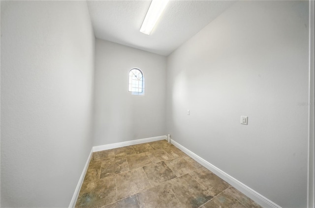 7624 Pointe Venezia Dr, Orlando, FL 32836 - empty room with baseboards and stone finish flooring