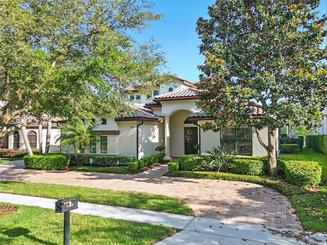 7624 Pointe Venezia Dr, Orlando, FL 32836 - mediterranean / spanish house featuring stucco siding and a tile roof