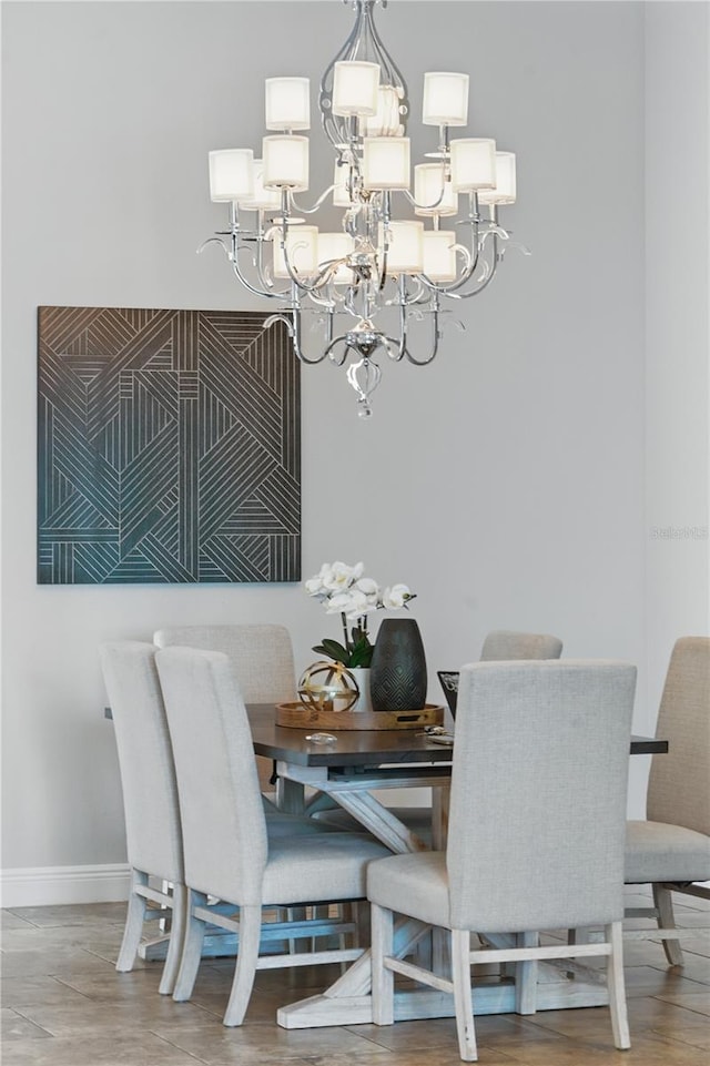 7624 Pointe Venezia Dr, Orlando, FL 32836 - dining room featuring a chandelier and baseboards