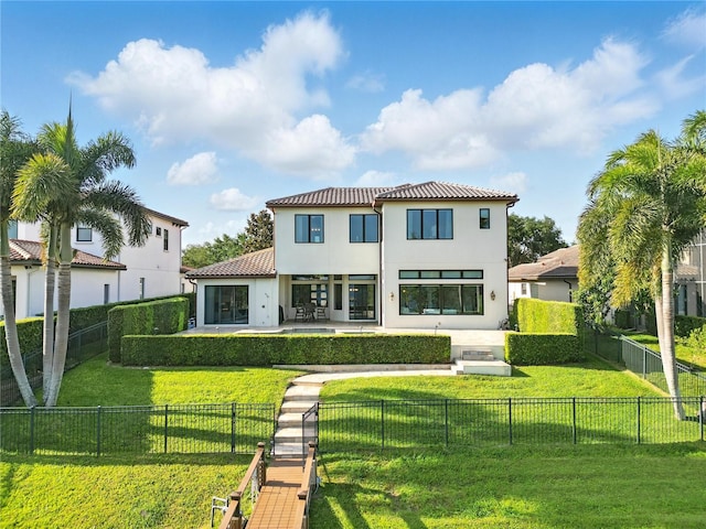 7624 Pointe Venezia Dr, Orlando, FL 32836 - back of house featuring a patio, stucco siding, a tiled roof, and a fenced backyard