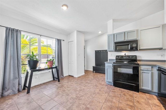 kitchen featuring recessed lighting, baseboards, gray cabinetry, and black appliances