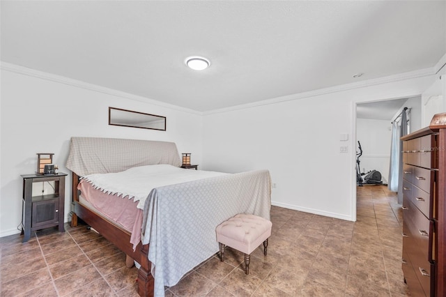 bedroom with baseboards and crown molding
