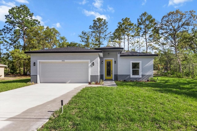 3851 W Wilburton Dr, Citrus Springs, FL 34433 - view of front of property featuring a front lawn, an attached garage, driveway, brick siding, and stucco siding