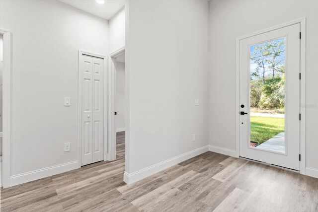 3851 W Wilburton Dr, Citrus Springs, FL 34433 - foyer entrance featuring light wood-style flooring and baseboards