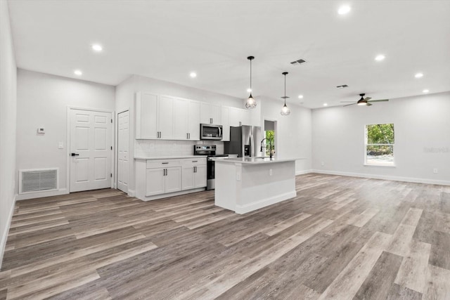 3851 W Wilburton Dr, Citrus Springs, FL 34433 - kitchen featuring recessed lighting, appliances with stainless steel finishes, visible vents, a ceiling fan, and open floor plan