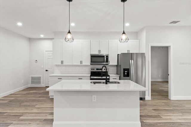 3851 W Wilburton Dr, Citrus Springs, FL 34433 - kitchen featuring a sink, baseboards, appliances with stainless steel finishes, and visible vents