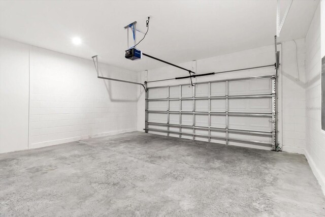 3851 W Wilburton Dr, Citrus Springs, FL 34433 - garage with a garage door opener and concrete block wall