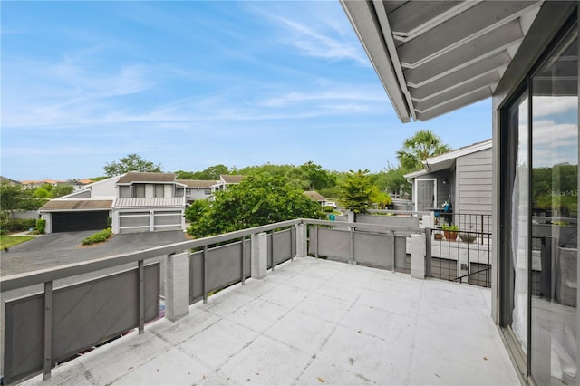 view of patio / terrace featuring a balcony and a residential view