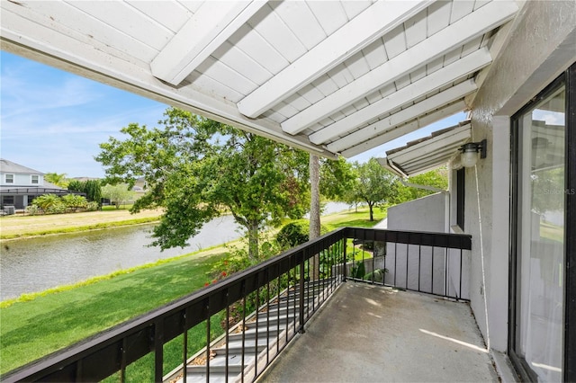 balcony featuring a water view
