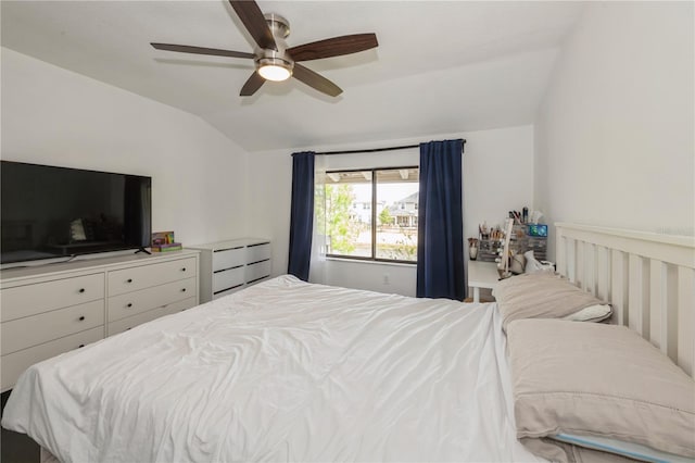 bedroom featuring a ceiling fan and lofted ceiling