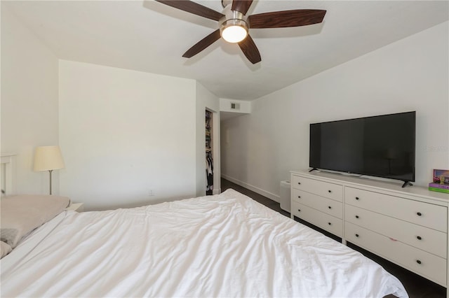 bedroom featuring baseboards, visible vents, and ceiling fan