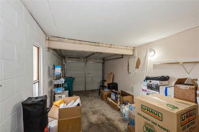 garage with concrete block wall