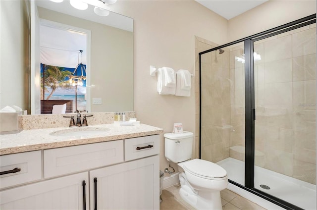 full bath with vanity, tile patterned flooring, a stall shower, and toilet