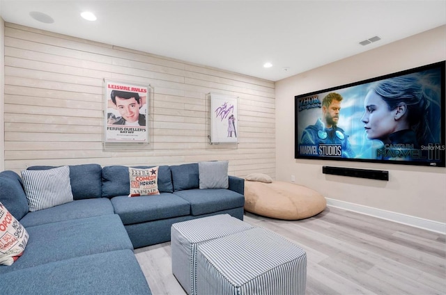 home theater room with visible vents, recessed lighting, baseboards, and wood finished floors